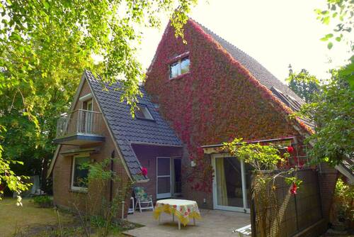Rückansicht mit Terrasse - 7 Zimmer Einfamilienhaus zum Kaufen in Butjadingen