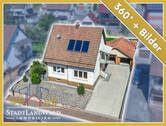 Titelbild - Sofort bezugsbereit! Attraktives EFH mit 2 Wohneinheiten, Garten, Terrasse und Garagen