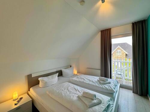 Schlafzimmer mit Balkonzugang - 