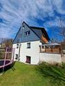 Giebelansicht Wohnhaus - Einfamilienhaus mit 158,00 m&sup2; in Mulda zum Kaufen