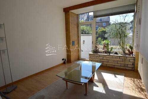 Wohnzimmer mit Sonnenbalkon Wohnung OG - 