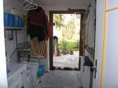 Waschküche mit Zugang zum Garten - 