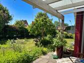 Blick von der überdachten Terrasse - Bungalow mit 110,40 m&sup2; in Husby zum Kaufen