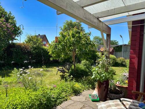 Blick von der überdachten Terrasse - Bungalow mit 110,40 m&sup2; in Husby zum Kaufen
