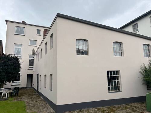 Außenansicht_Hinterhof - Mehrfamilienhaus, Wohnhaus mit 150,00 m² in Varel zum Kaufen