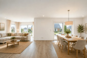 Das lichtdurchflutete Wohn- und Esszimmer (virtuell eingerichtet) - Einfamilienhaus mit 138,00 m&sup2; in Glowe zum Kaufen