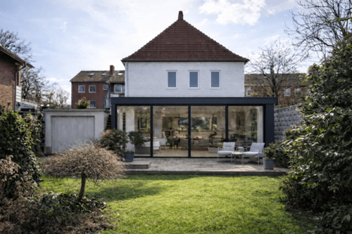 Vision eines modernen, lichtdurchfluteten Wohnbereichs mit direktem Gartenbezug - 7 Zimmer Mehrfamilienhaus, Wohnhaus in Gütersloh
