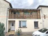 Eingang zum Haus und Balkon - Einfamilienhaus mit 210,00 m&sup2; in Eisleben zum Kaufen