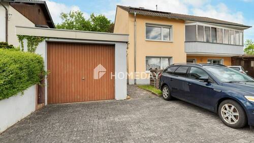 Garage - 7 Zimmer Einfamilienhaus zum Kaufen in Neuhof