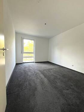 Schlafzimmer mit Teppichboden - 