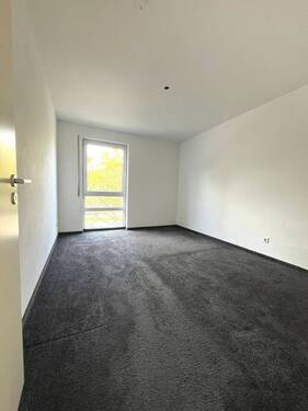 Schlafzimmer mit Teppichboden - 