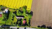 Luftaufnahme in Rapsblüte - 5 Zimmer Einfamilienhaus zum Kaufen in Groß Kordshagen / Flemendorf