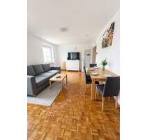 Kensington - Helle 2-Zimmer-Wohnung mit Südloggia, ruhiger Lage & eigener Garage - Planegg