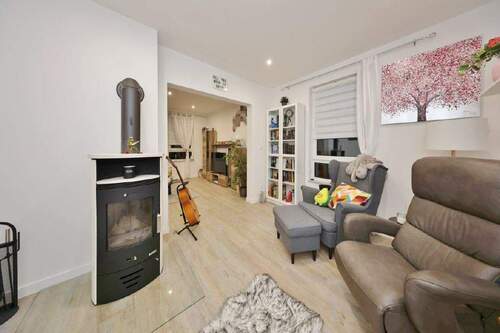 Wohnzimmer mit Kaminofen - 