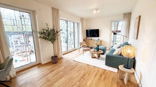 E+A_Wohnzimmer Musterwohnung - 4 Zimmer Etagenwohnung in Hamburg / Groß Borstel