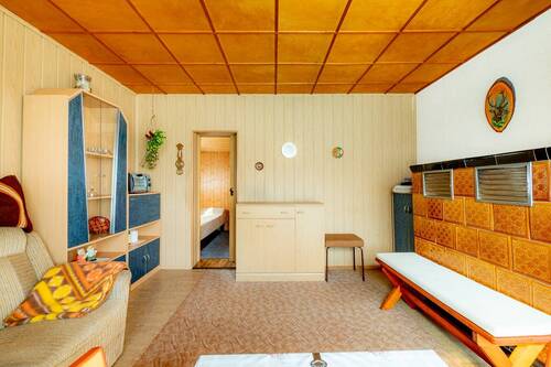 Wohnzimmer mit Kachelofen - 