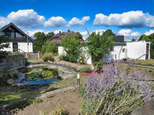 Teich mit Garage und Carport - Einfamilienhaus mit 147,00 m&sup2; in Wolfsburg zum Kaufen