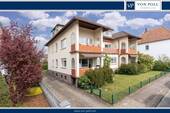 Titelbild - Großzügige Hochparterre-Wohnung mit Balkon 
