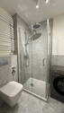 Badezimmer mit Waschmaschine - 