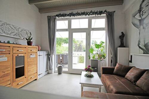 zweiter Wohnbereich mit Zugang zur Terrasse - 