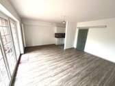 Wohnzimmer mit offener Küche - 2 Zimmer Etagenwohnung in Achim