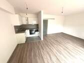 Wohnzimmer mit offener Küche - Etagenwohnung mit 52,00 m² in Achim zur Miete