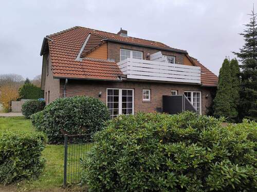 Außenansicht hinten - Charmante 3-Zimmer-Gartenwohnung vor den Toren Norddeich