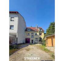 Attraktives Mehrfamilienhaus mit Ladengeschäft in zentraler Lage in Ettlingen