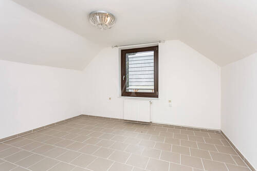 Schlafzimmer eins im Dachgeschoss - 