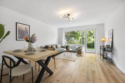 Wohn- und Esszimmer - Hochwertig sanierte Erdgeschosswohnung mit großer Terrasse und TOP Lage auf dem Priwall