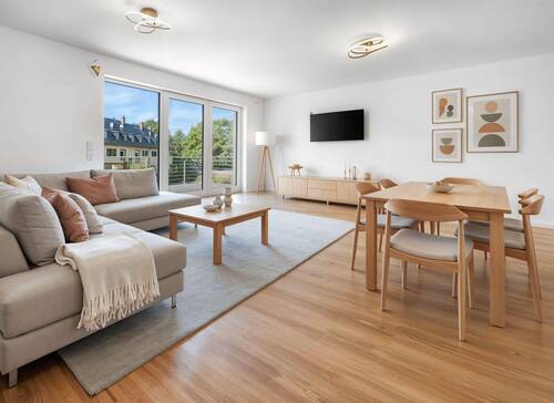 Lichtdurchflutetes Wohnzimmer - MODERN & ZUKUNFTSGERICHTET: Cozy 3-Zimmer-ETW aus 2023 mit Wärmepumpe (A+) in den Niddagärten