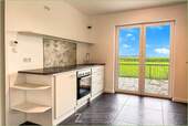 Moderne Küche mit ländlichem Ausblick - Einfamilienhaus mit 105,00 m² in Tetenbüll zum Kaufen