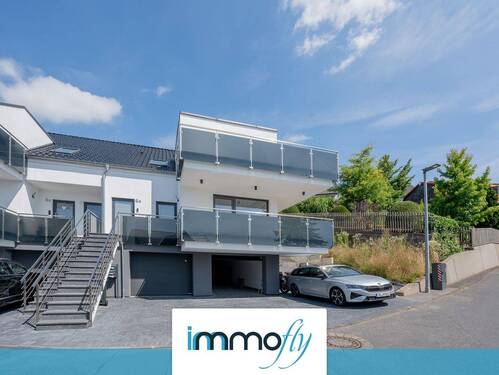 Hausansicht - Architektur trifft Achtsamkeit: Stilvolle Etagenwohnung mit Bergblick, Terrasse & grüner Technik