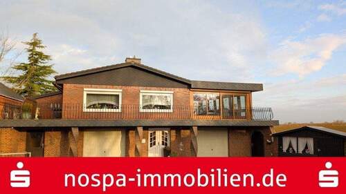 Frontansicht - Einfamilienhaus mit Wintergarten, großer Dachterrasse, viel Nutzfläche und großzügiger Garage!