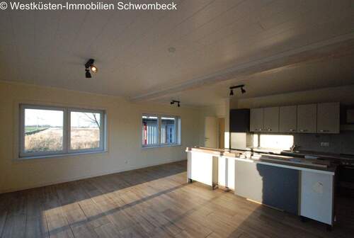 Wohnzimmer mit Küche - Terrassenwohnung mit 70,00 m&sup2; in Hemme zur Miete