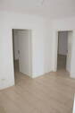 Flur mit Sicht auf 2 Zimmer - 