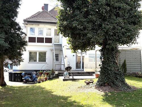 Hausansicht hinten.jpg - 7 Zimmer Mehrfamilienhaus, Wohnhaus zum Kaufen in Gütersloh