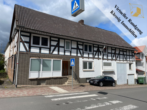 vordere Hausansicht - 7 Zimmer Einfamilienhaus zum Kaufen in Habichtswald