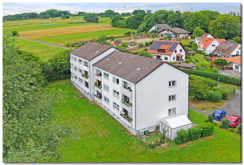 Bild1 - 2 Mehrfamilienhäuser mit 12 Wohnungen, komplett vermietet in schöner Feldrandlage von Helsa