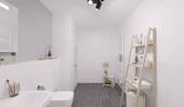 Ein modern gefliestes Badezimmer mit bodengleicher Dusche - 