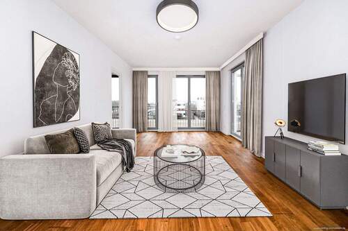 Wohnzimmer - visualisiertes Einrichtungsbeispiel - Riem - Lichtdurchflutete 3-Zimmer-Wohnung mit großer Terrasse, TG-Stellplatz & Lift in ruhiger Lage