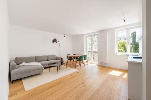 Wohnzimmer - AIGNER - Kernsanierte 2-Zimmer-Wohnung mit Balkon in Uni-Nähe