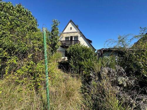 Blick vom Garten zum Haus - Einfamilienhaus mit 128,00 m&sup2; in Nürnberg zum Kaufen