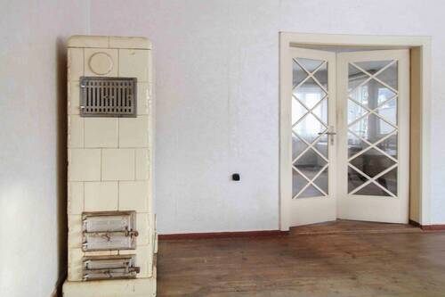 Ofen im Wohnzimmer - Einfamilienhaus in Garz/Rügen zum Kaufen