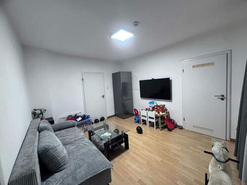 Wohnzimmer mit Spielbereich - 