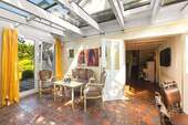 Wintergarten mit Kaminofen - 