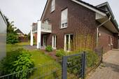 Gartenansicht - Großzügige 3-Zimmer Erdgeschosswohnung mit Garten