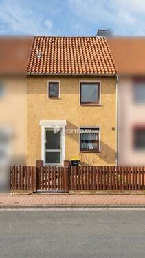Außenansicht 1 - Charmantes Reihenhaus mit Gartenidylle und Ausbaupotenzial in zentraler Lage