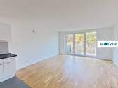 Ansicht I: Wohn- und Esszimmer mit offener Küche und Zugang zum Balkon - 3 Zimmer Etagenwohnung zur Miete in Hannover