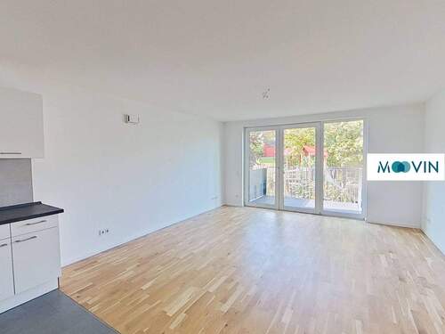 Ansicht I: Wohn- und Esszimmer mit offener Küche und Zugang zum Balkon - 3 Zimmer Etagenwohnung zur Miete in Hannover